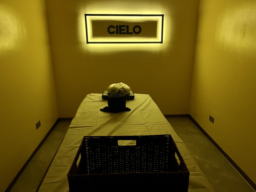 a bed in a room with a sign